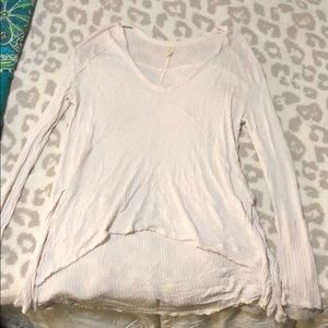 A long sleeve cream Free People Shirt.